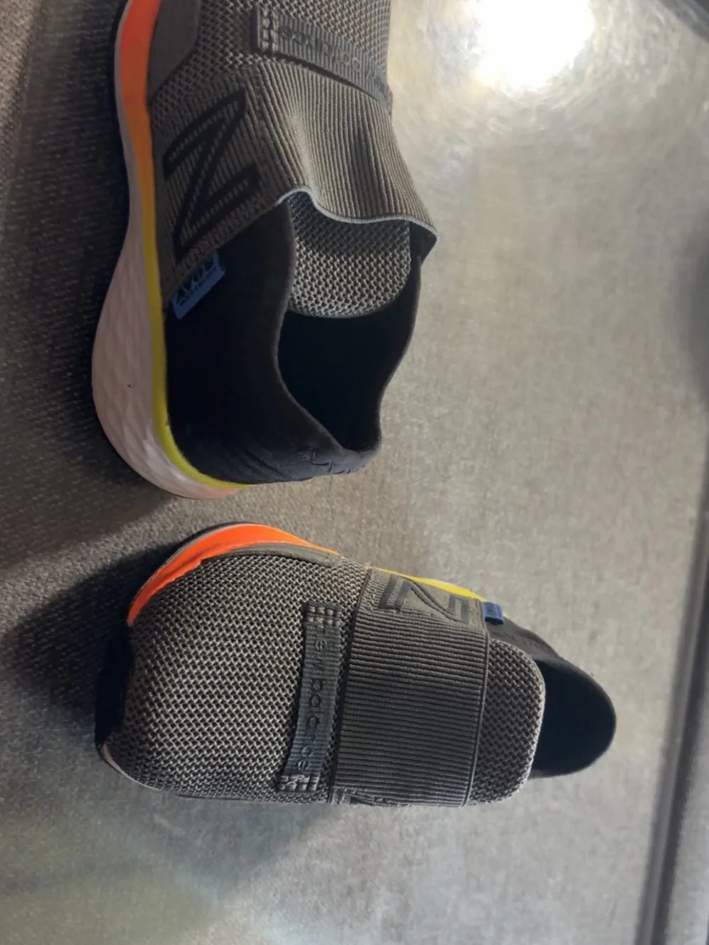 New Balance Gray Knit Slip-On Sneakers with Orange and Yellow Accents